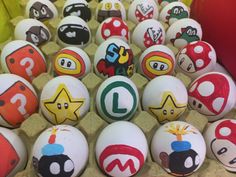 an assortment of nintendo themed eggs on display