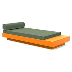 an orange and green daybed sitting on top of a white floor next to a roll of paper