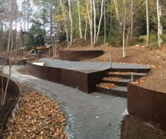 an outdoor area with steps made out of concrete and trees in the backgroud