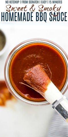 homemade bbq sauce in a glass jar with a spoon