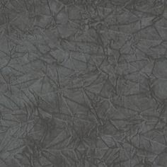 an image of a dark gray background with some cracks in it's surface that looks like paper