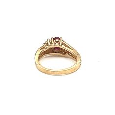 This stunning oval-shaped ring is crafted from 14k yellow gold and features a gorgeous 0.93 carat red ruby as its main stone. The ruby is accentuated by sparkling diamonds and set in an elegant design. The ring is size 5 3/4 and is made from high-quality materials. The piece is perfect for those looking for a fine jewelry piece that will make a statement. The gemstones are of exceptional quality and the design is timeless. This ring is a must-have addition to any jewelry collection. Classic Oval Lab-created Ruby Diamond Ring, Red Oval Birthstone Ring With Prong Setting, Gold Marquise Cut Ruby Diamond Ring, Classic Ruby Ring With Pear-shaped Stone, Gold Ruby Ring With Marquise Cut And Accent Stones, 14k Gold Oval Ruby Ring With Center Stone, Ruby Ring With Center Stone For Anniversary, Lab-created Ruby Ring With Brilliant Cut In Oval Shape, Classic Pear-shaped Ruby Ring