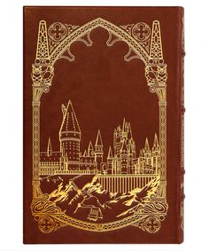 a brown and gold book with a castle on it