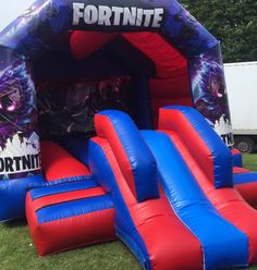 an inflatable fortnite bounce house with slide