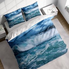 a bed with blue ocean waves on it