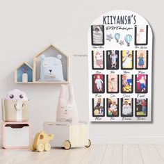 there are many toys on the floor in front of this wall calendar that says, kittanish's entertainment