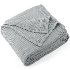 the grey blanket is folded on top of it