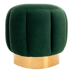 a green chair with gold legs and a round foot rest on it's side