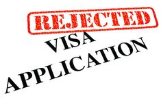 a visa application with the words reflected in red ink on top of it, and an orange rubber stamp that says visa application