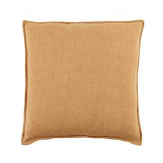 a tan pillow on a white background