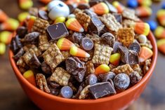 a bowl filled with halloween treats on top of a table