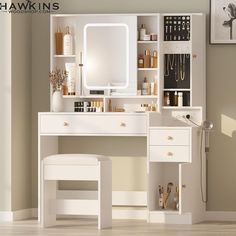 a white vanity with mirror and stool in a room