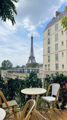 the view of the eiffel tower from an apartment balcony