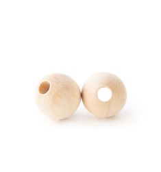 two wooden beads sitting side by side on a white surface