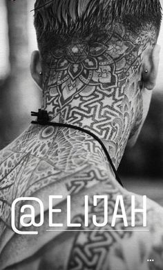 the back of a man's head with tattoos on his neck and chest, in black