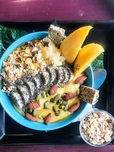 a blue bowl filled with different types of food