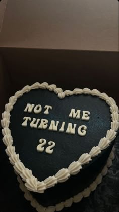 a heart shaped cake with the words not me turning 29 written on it in white frosting