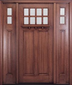 a wooden door with two side panels and windows