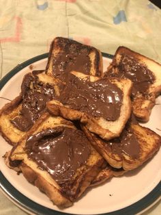 some pieces of bread with chocolate spread on them