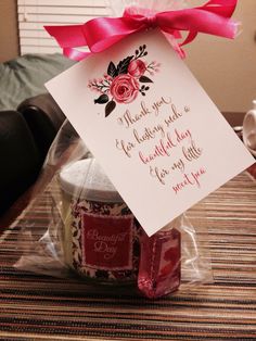 a jar of jam with a card attached to it