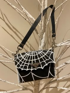 Hand carved and hand painted spiderweb purse ready just in time for Spooky Season.  Small, simple black bag with a removable strap for those interested in changing it for a longer or more decorative strap. Purse fits a regular sized smart phone, keys and a wallet with room left over for some make up or any other small purse essential.  Please note, this item is 100% hand made from 100% real leather. This means there may be some minor hide defects or some small defects from the creation process. Small Purse Essentials, Simple Black Bag, Gothic Bag, Hand Bags For Women, Kei Visual, Purse Essentials, Strap Purse, Women Purse, Small Purse