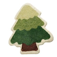 a green and brown christmas tree shaped rug on a white background with the shape of a fir tree