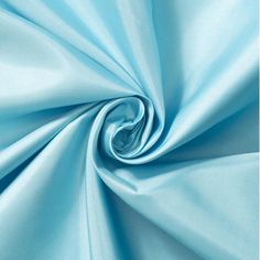 a close up shot of a light blue fabric