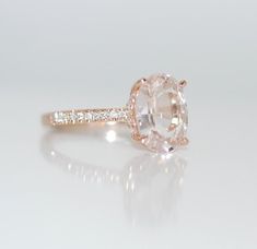 an oval cut diamond ring with side stones