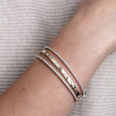 Always swooning over the classics. DETAILS Metal - available in 14k yellow or white gold Diamond(s) - ~1.10tcw Bangle bracelet with safety clasp WHY WE LOVE IT A bigger + bolder version of the Leia Bracelet. Still simple, still dainty, just bigger diamonds, but who doesn't love to hear that? ~1.10tcw of diamonds travel halfway around this 14k gold bangle - a hinge halfway down along with a solid safety clasp creates easy and secure fastening. SHIPPING + RETURNS Please allow 1-2 weeks for sizing Luxury Minimalist Open Band Bracelet, Dinh Van Bracelet, Timeless Cuff Bracelet With Diamond Accents, Elegant Stackable Sterling Silver Bracelet For Anniversary, Elegant Sterling Silver Stackable Bracelet For Anniversary, Timeless White Gold Cuff Bracelet For Everyday Luxury, Modern Diamond Cut Bracelet For Anniversary, Elegant White Gold Bangle For Everyday, Elegant Everyday White Gold Bangle