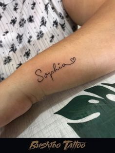 someone has a tattoo on their arm that reads, sonfio and is in cursive writing