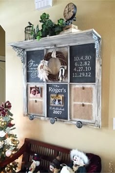 an old window is decorated with family photos and magnets