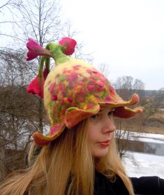 Beautiful bell shaped hat with pink and purple flowers. Unique hat in which you will feel amazingly good. It is from natural material and created with love. Warmth, coziness, pleasure and festive feeling will embrace you. Good mood is guaranteed. A good gift for a good person. This hat is made of 100% wool using wet felting technique. Its made by my hands in my small home studio. Materials: New Zealand sheep wool 100% Hats can be ordered in any colors and sizes. If you want the hat just like in Whimsical Flower Costume Hats For Party, Whimsical Adjustable Hat For Carnival, Whimsical Adjustable Hats For Carnival, Whimsical Wide Brim Winter Hat, Fun Brimmed Mini Hats For Winter, Unique Winter Brimmed Hat, Whimsical Wide Brim Multicolor Hats, Unique Brimmed Winter Hat, Whimsical Brimmed Party Hat