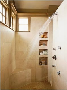 a shower head with the light coming through it's window in a tiled bathroom