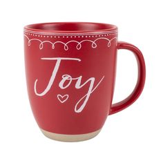 a red coffee mug with the word joy written on it and hearts in white lettering