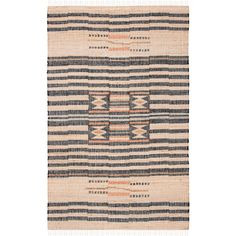 a black and white striped rug with an orange stripe on the bottom, in front of a