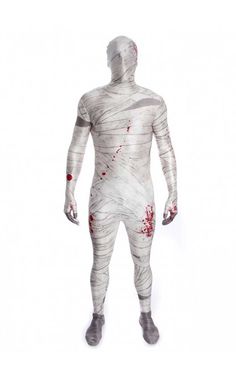 a man in a white body suit with blood on the chest and arms, standing