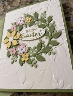 a close up of a greeting card with flowers on the front and back of it