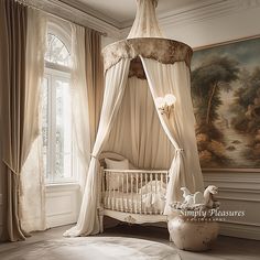 a baby's room with a canopy bed and crib