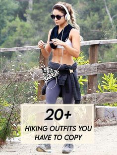 a woman wearing headphones and running while looking at her cell phone with the words 20 hiking outfits you have to copy