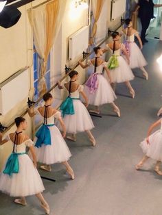 a group of young ballerinas in white tutu skirts