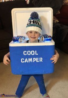 a young boy is dressed up as a cooler with water bottles in it and a hat that says cool camper