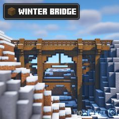 an image of a bridge in minecraft with snow on the ground and buildings around it