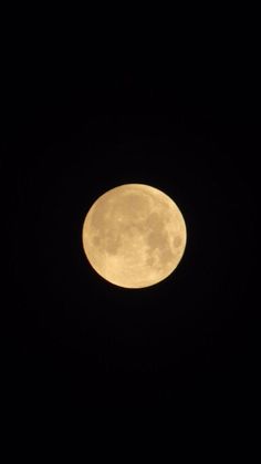 the full moon is seen in the dark sky