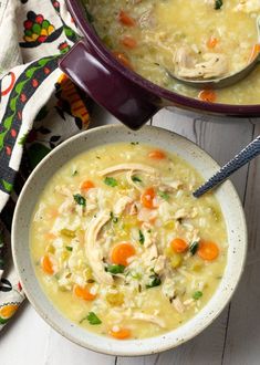 two bowls filled with chicken and vegetable soup