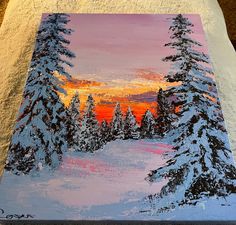 a painting of snow covered pine trees in the sunset with pink and orange sky behind it