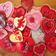 many heart shaped valentine's day decorations are laid out on the floor