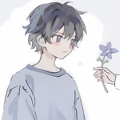 a person holding a flower in front of another person's face with their hand