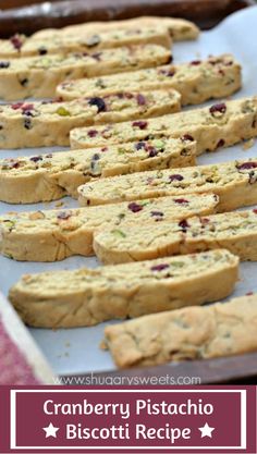 cranberry pistachio biscotti recipe on a baking sheet with text overlay