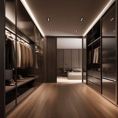 a large walk in closet with wooden floors and glass doors that lead to the bedroom