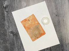 a piece of paper with a ring on it